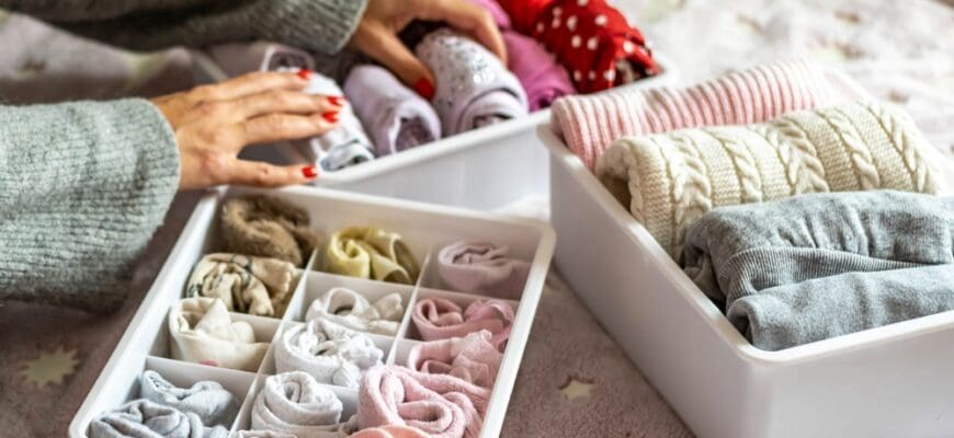 Top,View,Mother,Hands,Neatly,Putting,Female,Kid,Clothes,Into